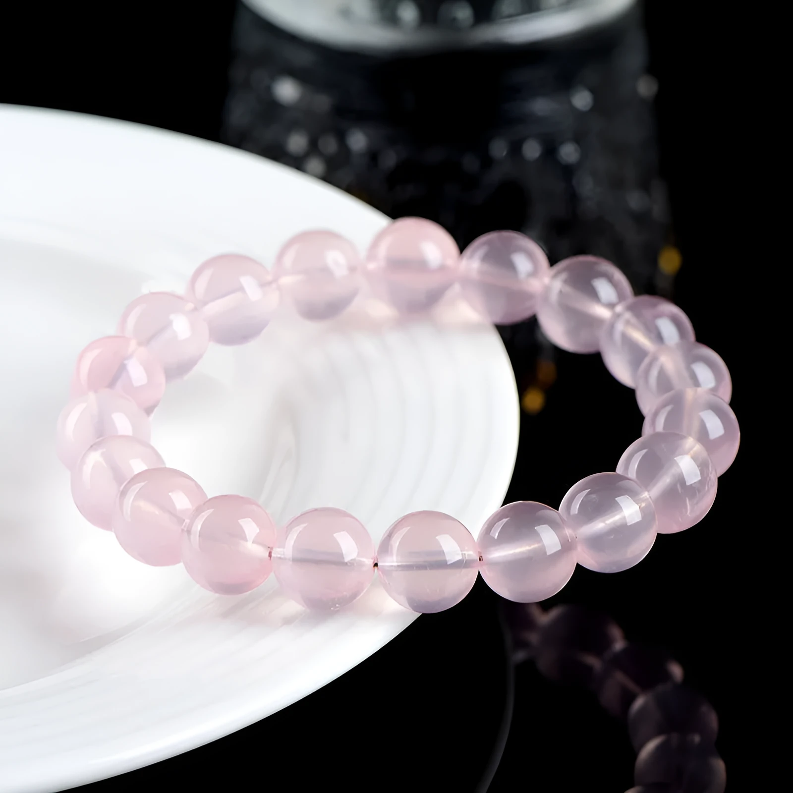 Crystal bracelet with polished pink round beads in natural starlight design showing single circle construction