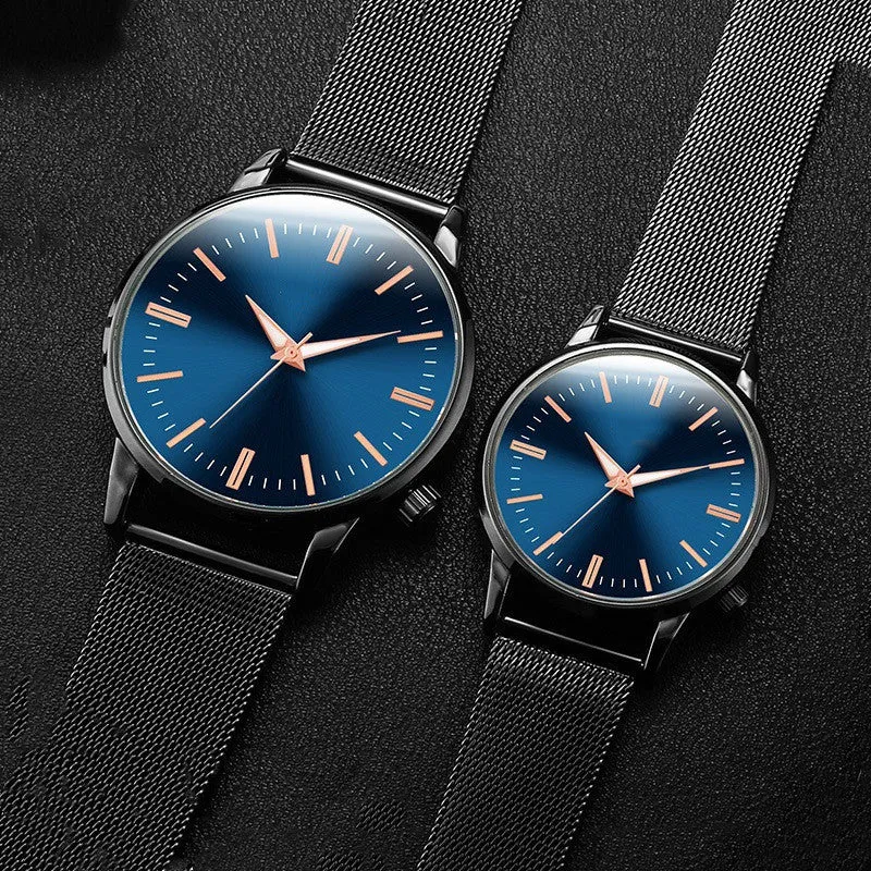 Men's and women's couple watch set with blue metal mesh band, luminous dial, and alloy case on a white background