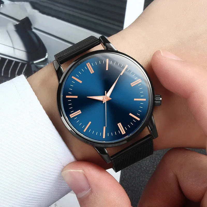 Men's and women's couple watch set with blue metal mesh band, luminous dial, and alloy case on a white background