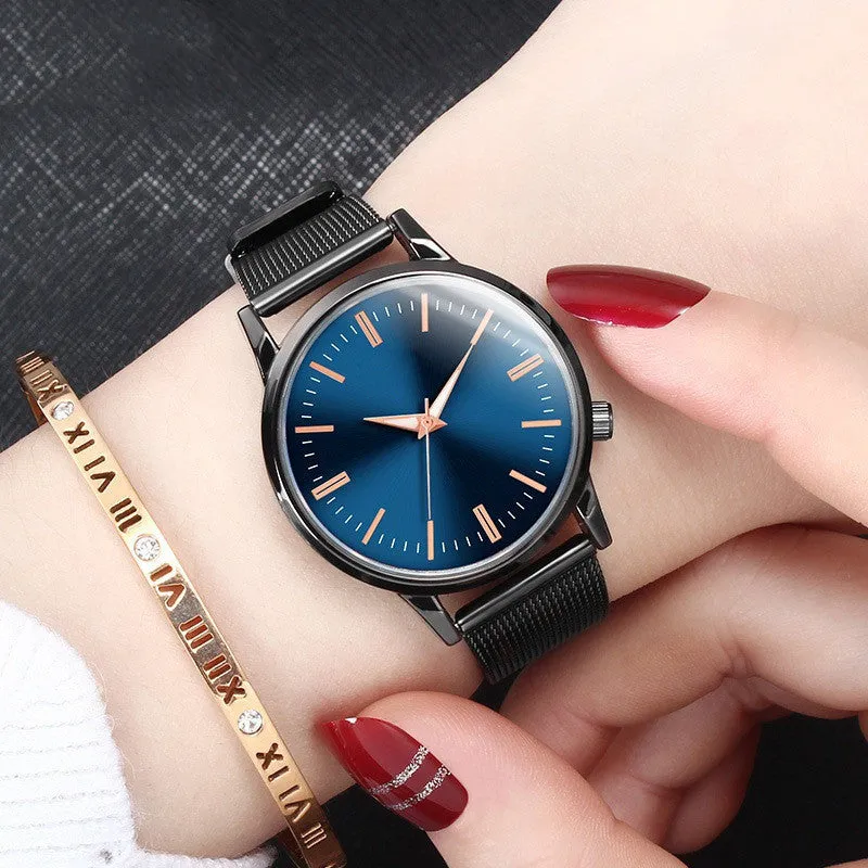 Men's and women's couple watch set with blue metal mesh band, luminous dial, and alloy case on a white background