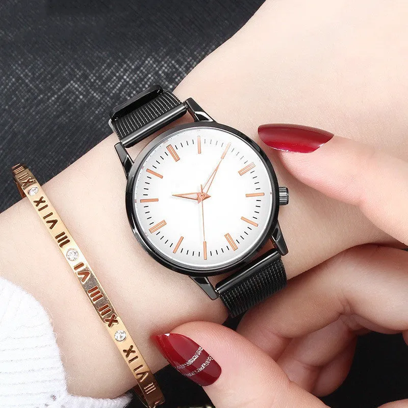 Men's and women's couple watch set with blue metal mesh band, luminous dial, and alloy case on a white background