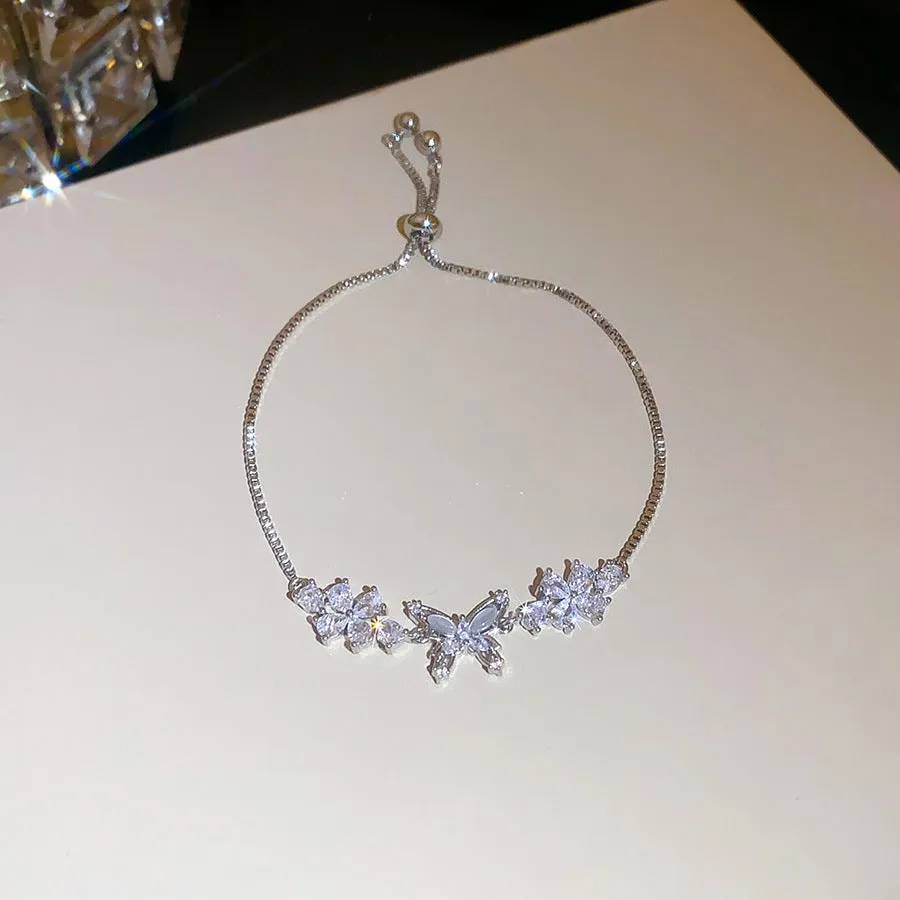 Flower butterfly pendant bracelet for women, copper inlaid zircon, gold finish on white background