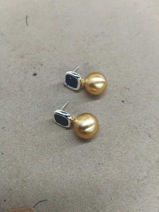 Women's copper matte geometric square round stud earrings in gold silver colour on neutral background
