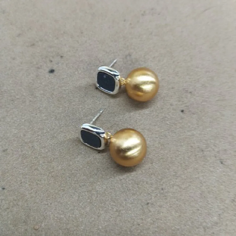 Women's copper matte geometric square round stud earrings in gold silver colour on neutral background