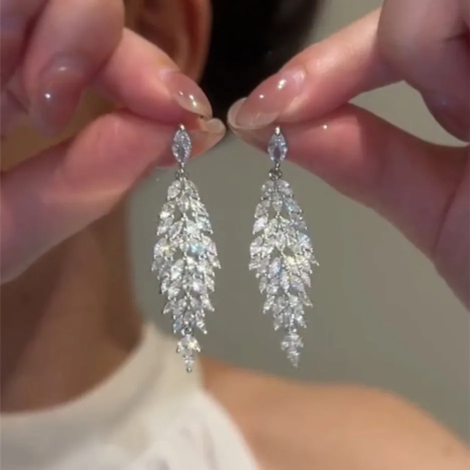 Silver anti-allergy auricular needle earrings with Japanese Korean style New Year design on alloy base