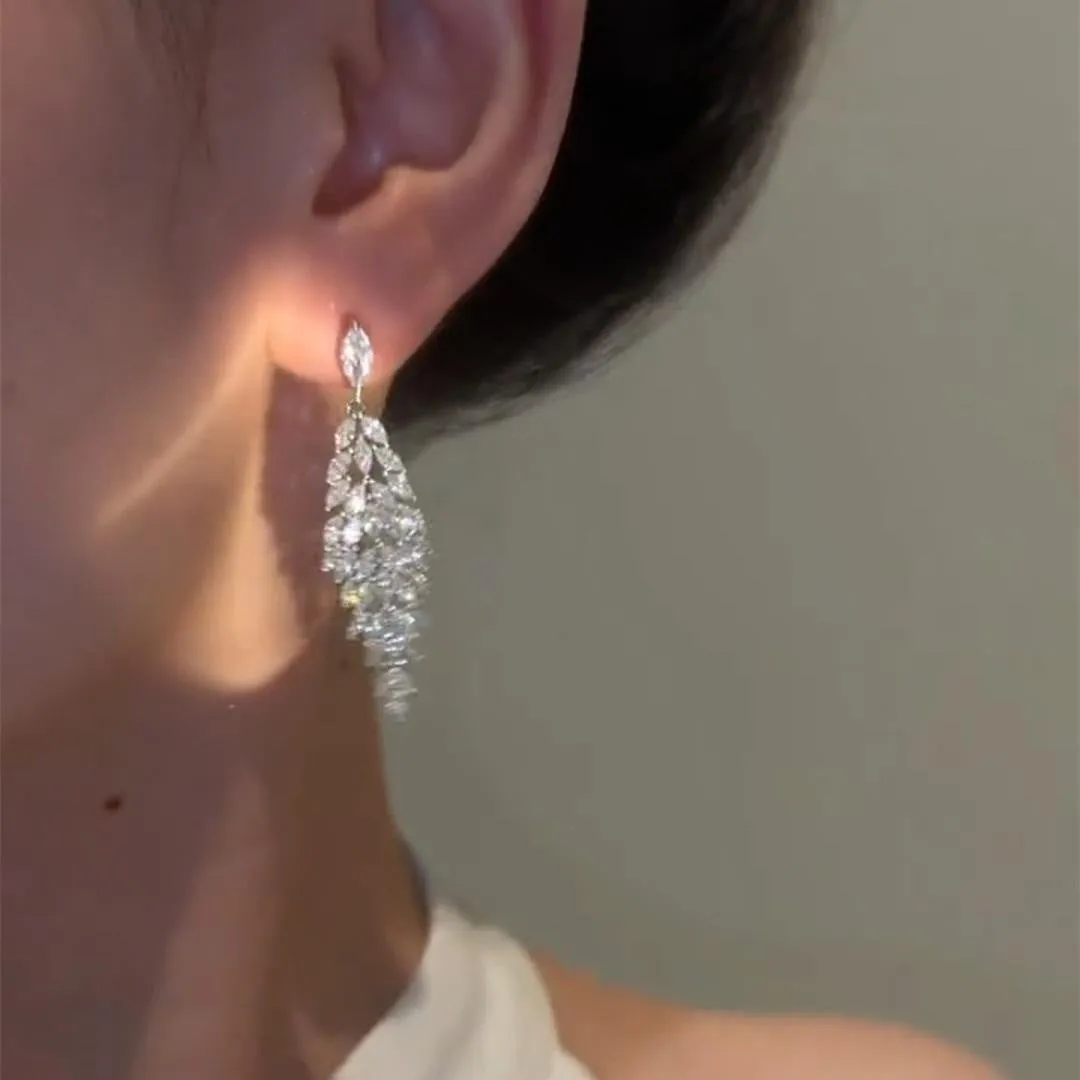 Silver anti-allergy auricular needle earrings with Japanese Korean style New Year design on alloy base