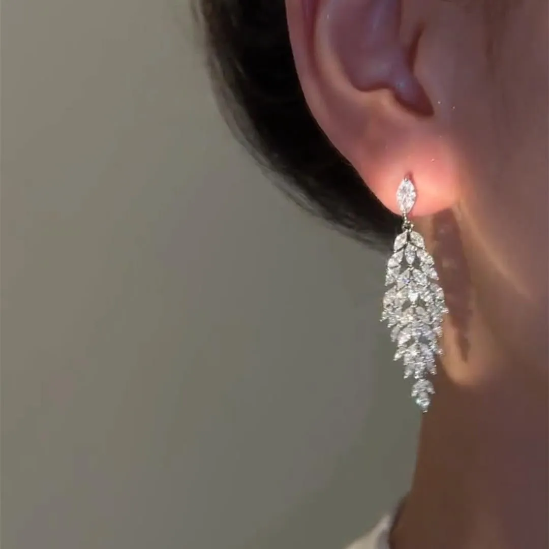 Silver anti-allergy auricular needle earrings with Japanese Korean style New Year design on alloy base