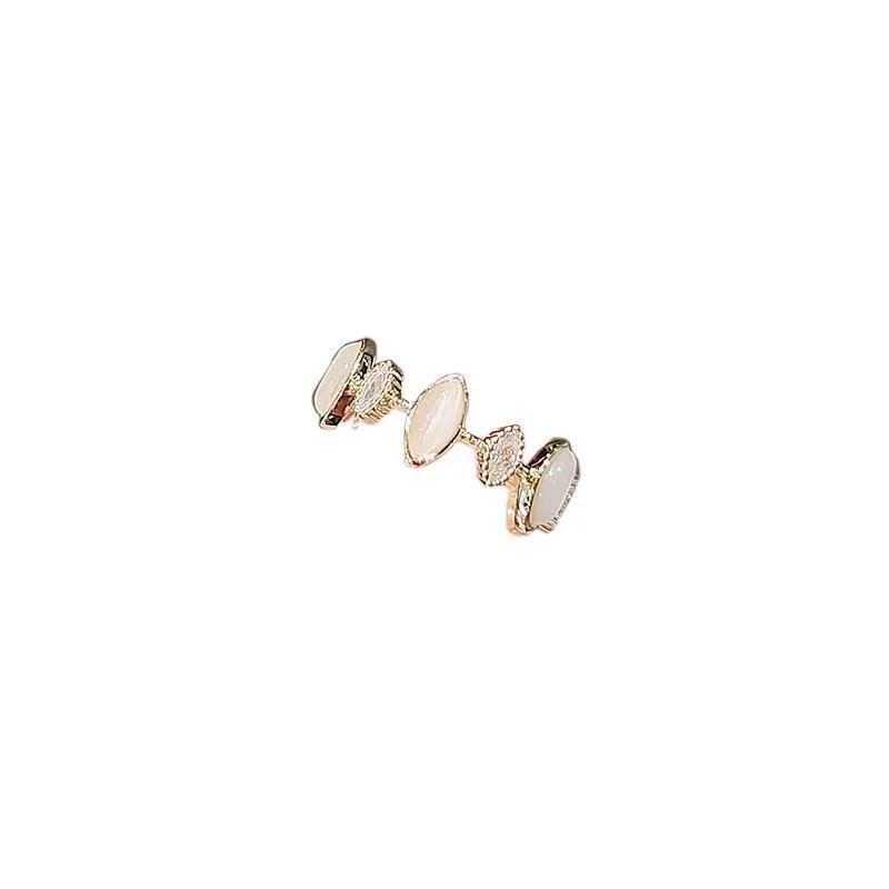 Copper geometric water drop ring for women with electroplated finish on white background