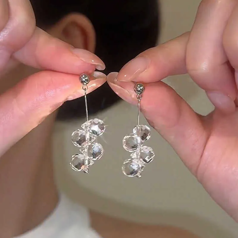 Silver needle simple crystal tassel earrings with geometric round shape in silver finish