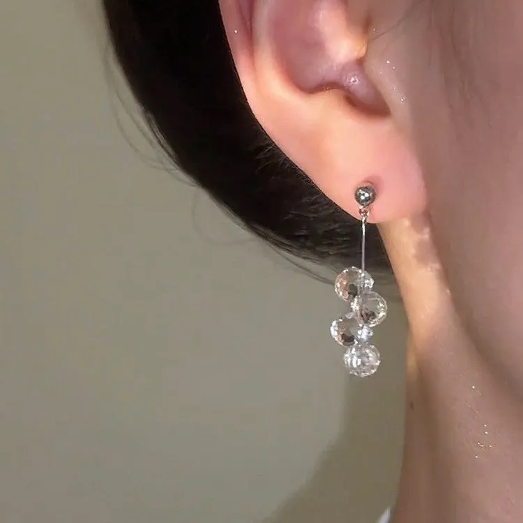 Silver needle simple crystal tassel earrings with geometric round shape in silver finish