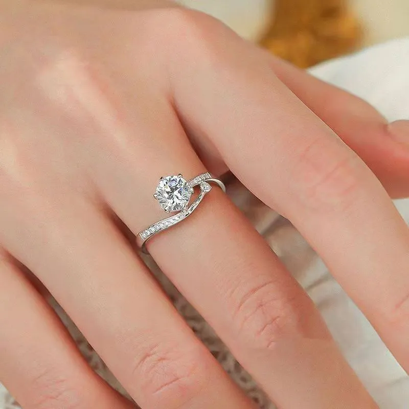 S925 sterling silver starry track ring with 1-karat oval plum blossom cut moissanite stone on white background