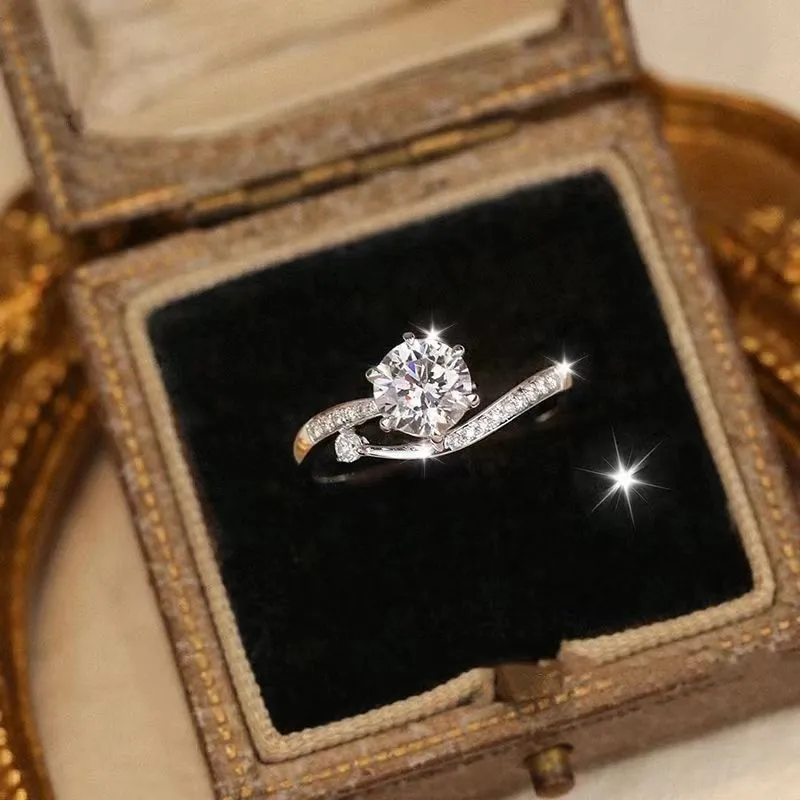 S925 sterling silver starry track ring with 1-karat oval plum blossom cut moissanite stone on white background