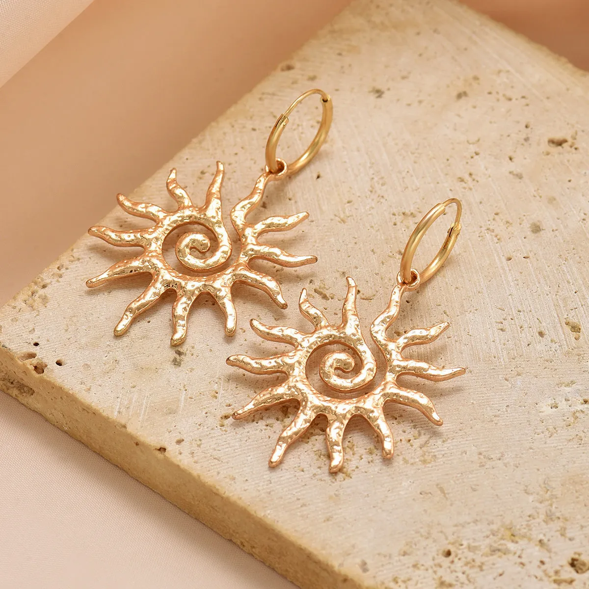 Gold sun hollow pendant necklace and earrings set with electroplated finish on zinc alloy