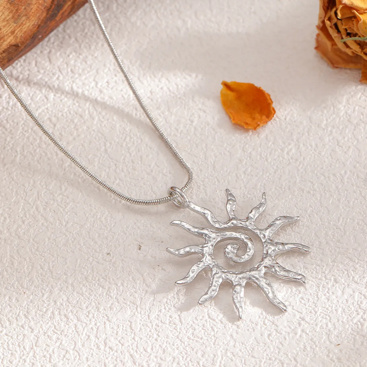 Gold sun hollow pendant necklace and earrings set with electroplated finish on zinc alloy