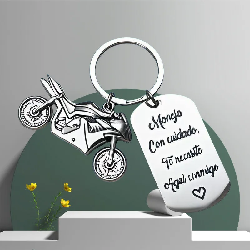 Stainless steel motorcycle keychain with velvet cloth on flannel background