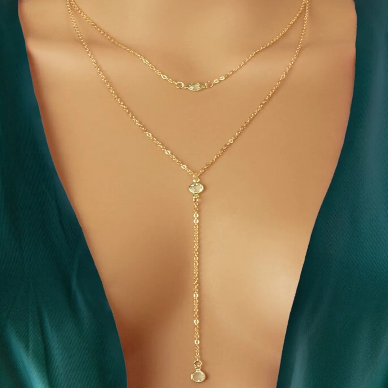 Alloy geometric pendant necklace with electroplated gold finish and O-ring chain on woman