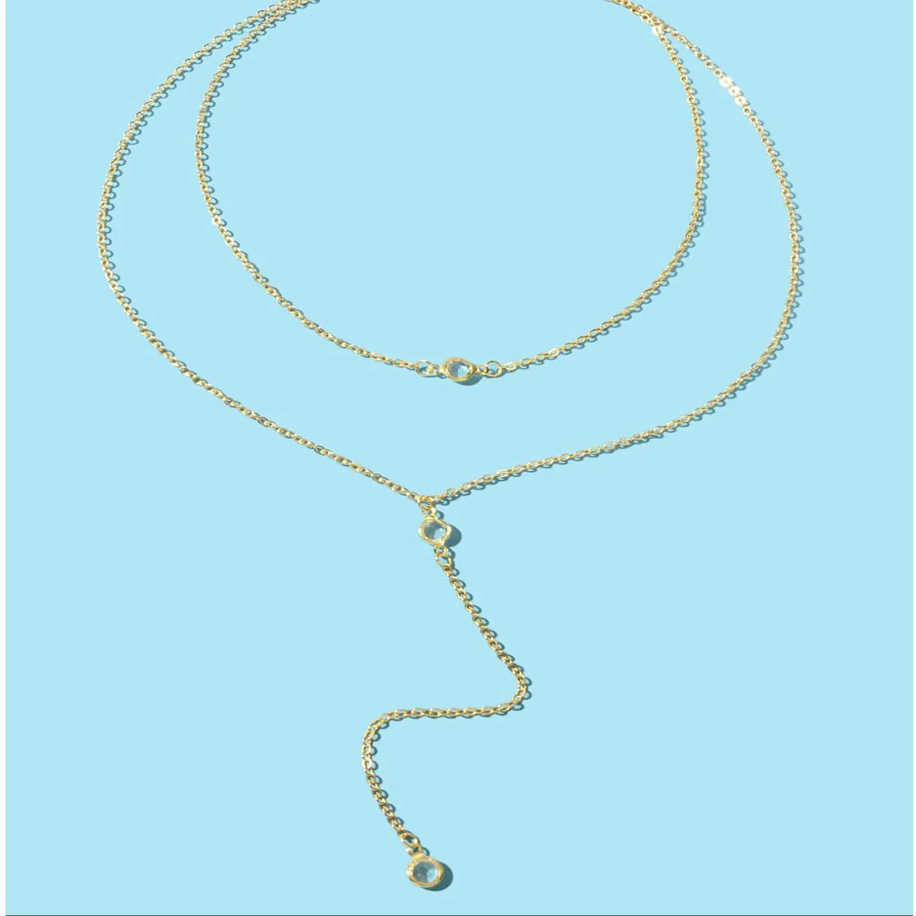 Alloy geometric pendant necklace with electroplated gold finish and O-ring chain on woman