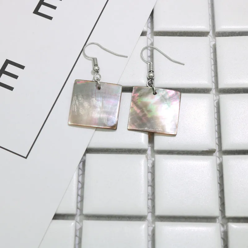 Women's geometric shell earrings showing rectangular and square shapes with natural shell material texture