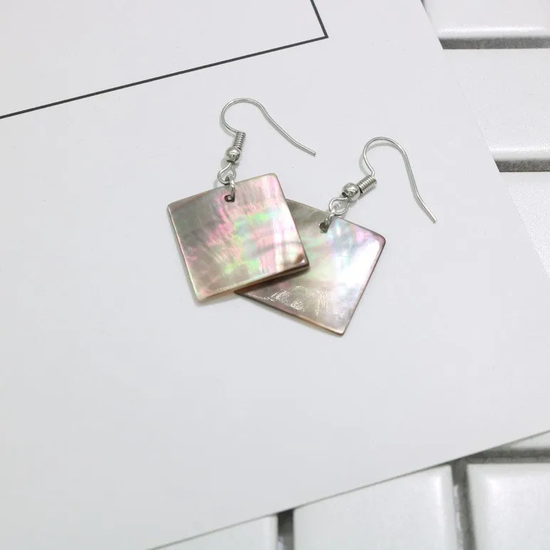 Women's geometric shell earrings showing rectangular and square shapes with natural shell material texture