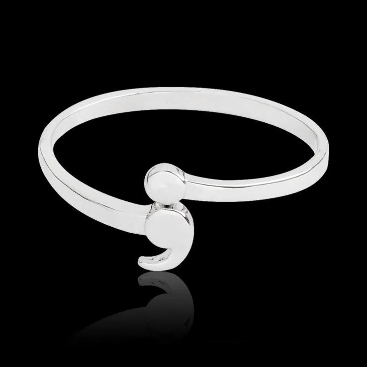 Women's silver-tone alloy ring available in sizes 5 to 10, simple band design