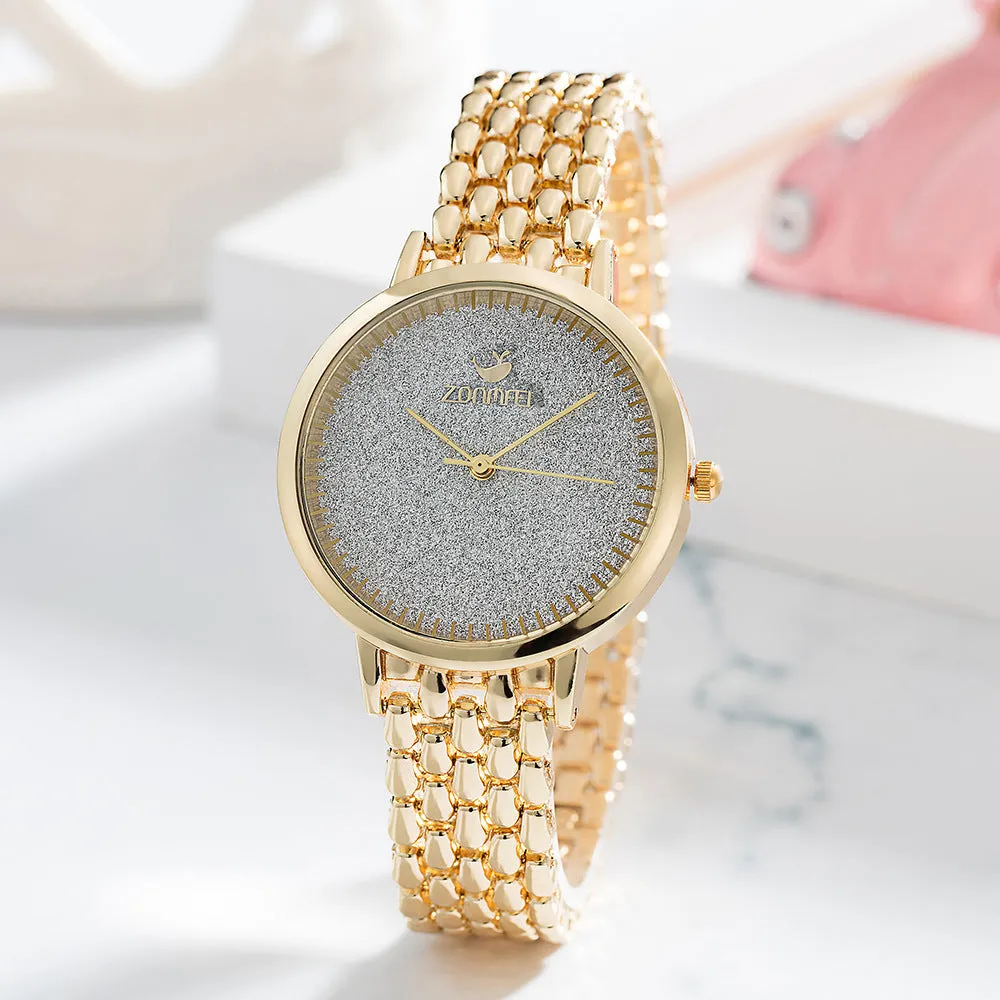 Gold women's watch set with earrings ring necklace bracelet on white background