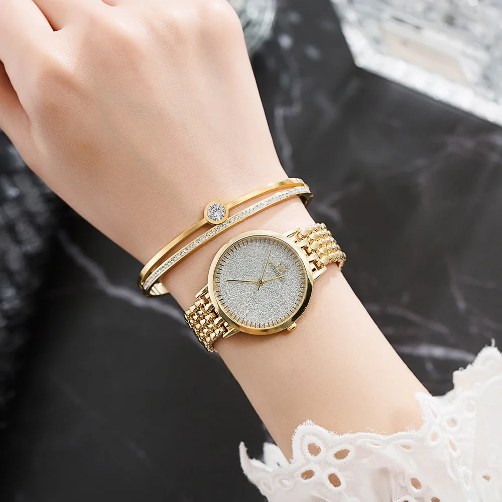 Gold women's watch set with earrings ring necklace bracelet on white background