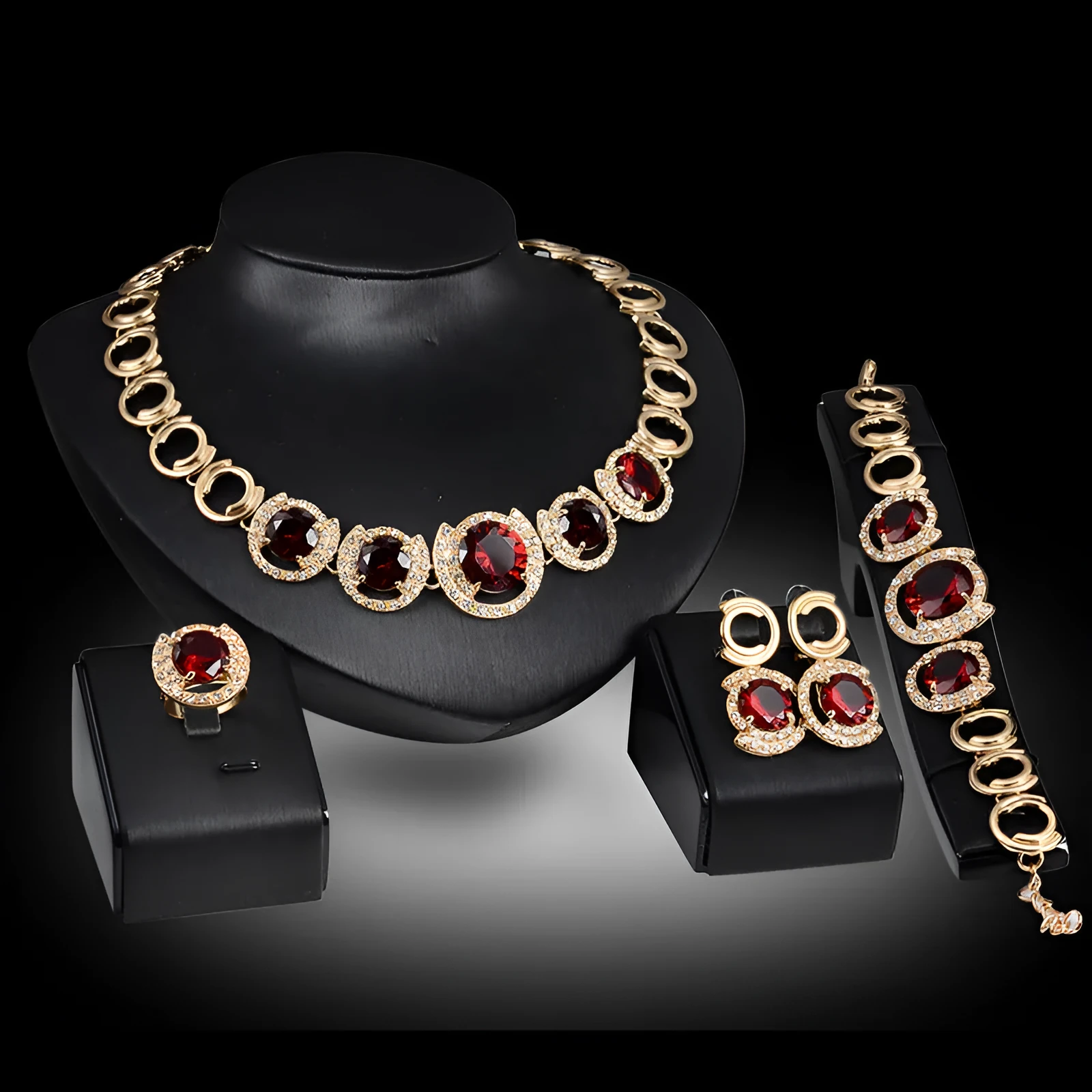 Gold-tone bridal jewellery set with crystal pendant necklace, earrings, ring, and bracelet with green red zircon stones