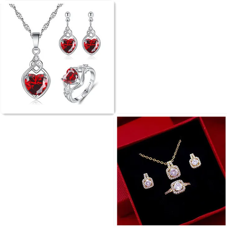 Gold-tone fashion jewellery set with zircon pendant necklace, stud earrings, and ring on white background