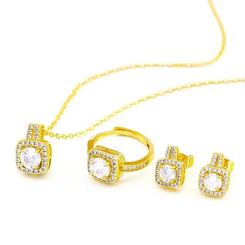 Gold-tone fashion jewellery set with zircon pendant necklace, stud earrings, and ring on white background