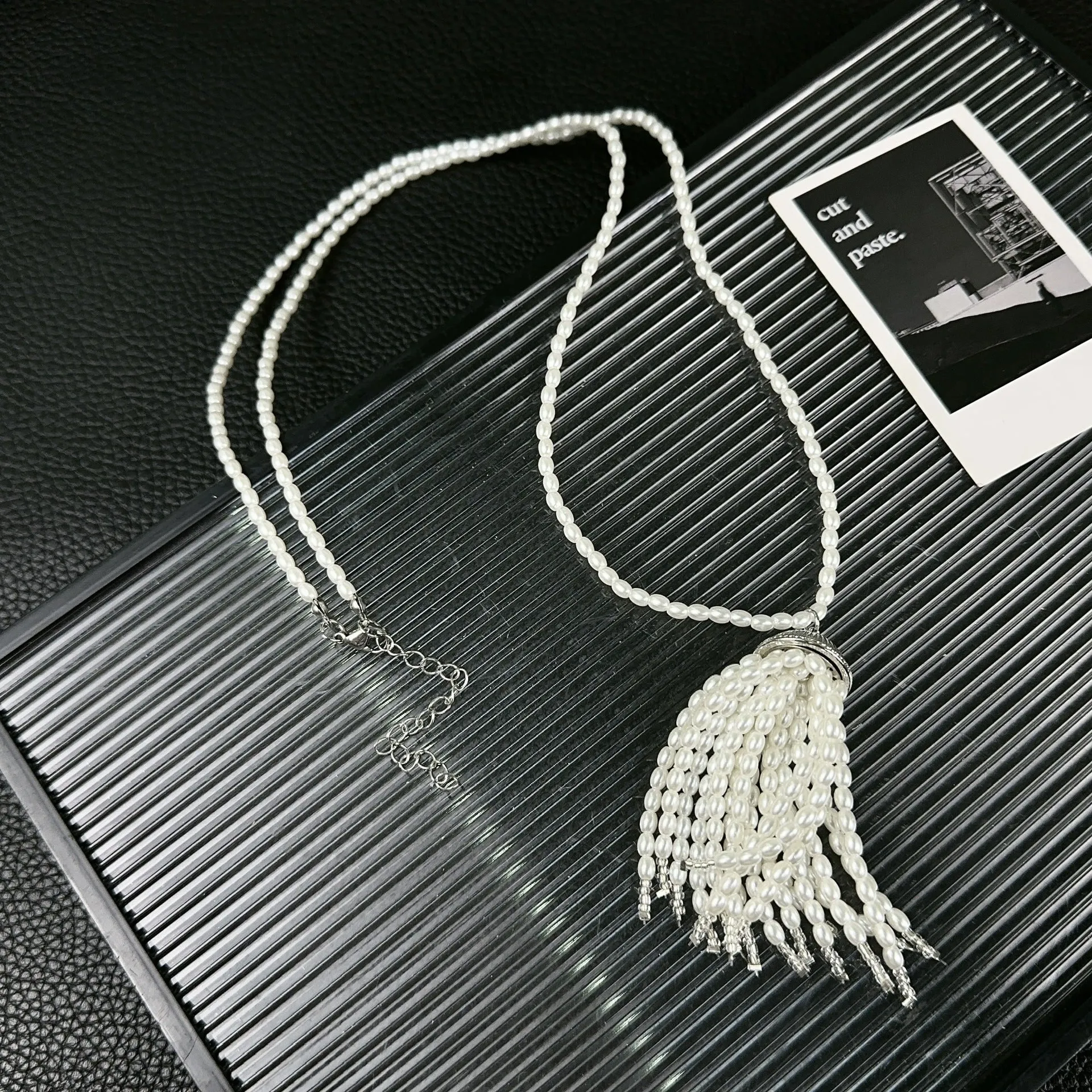 Women's pearl tassel necklace with long rice imitation pearl pendant and electroplated chain