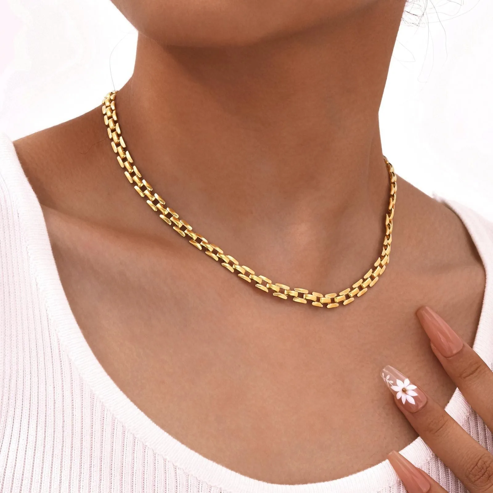 Stainless steel geometric twist necklace on snake bones chain, available in multiple colours