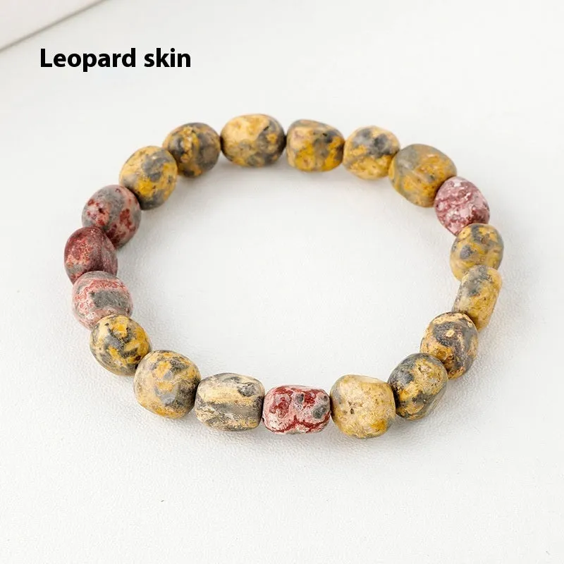 Natural amethyst large particle gravel rolling stone bracelet on a plain background showing smooth rounded beads