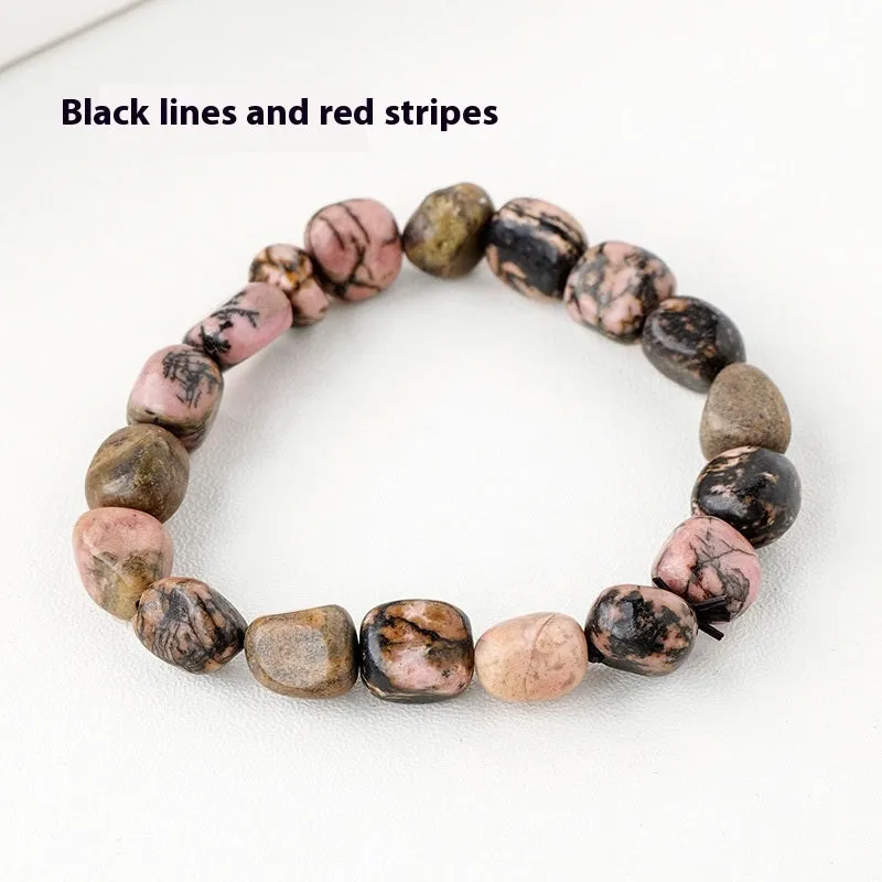 Natural amethyst large particle gravel rolling stone bracelet on a plain background showing smooth rounded beads