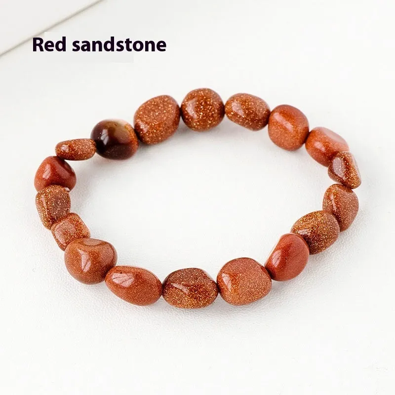 Natural amethyst large particle gravel rolling stone bracelet on a plain background showing smooth rounded beads