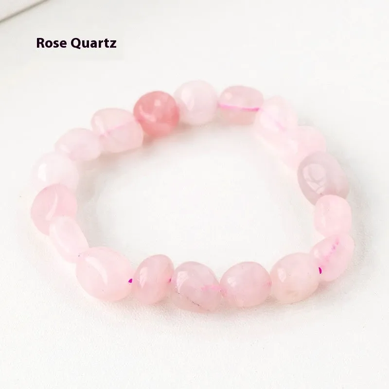 Natural amethyst large particle gravel rolling stone bracelet on a plain background showing smooth rounded beads