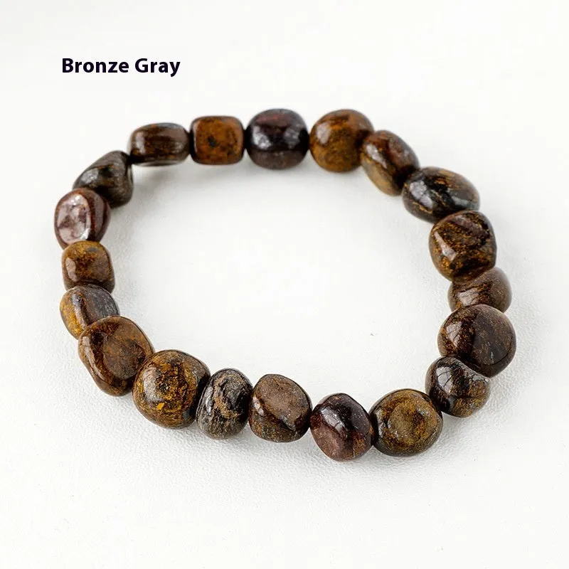 Natural amethyst large particle gravel rolling stone bracelet on a plain background showing smooth rounded beads