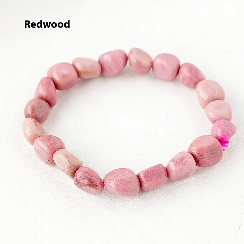 Natural amethyst large particle gravel rolling stone bracelet on a plain background showing smooth rounded beads