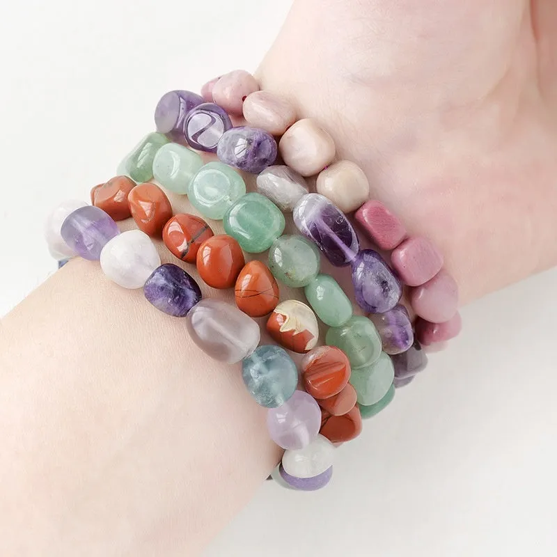 Natural amethyst large particle gravel rolling stone bracelet on a plain background showing smooth rounded beads