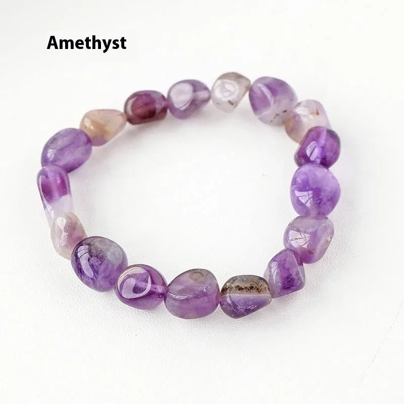 Natural amethyst large particle gravel rolling stone bracelet on a plain background showing smooth rounded beads