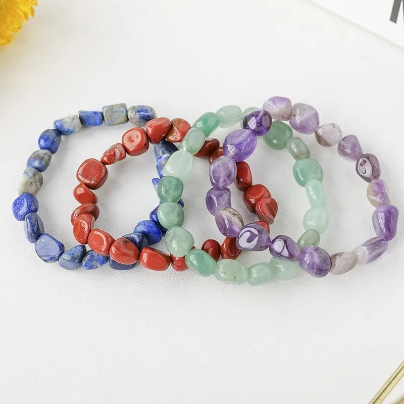 Natural amethyst large particle gravel rolling stone bracelet on a plain background showing smooth rounded beads