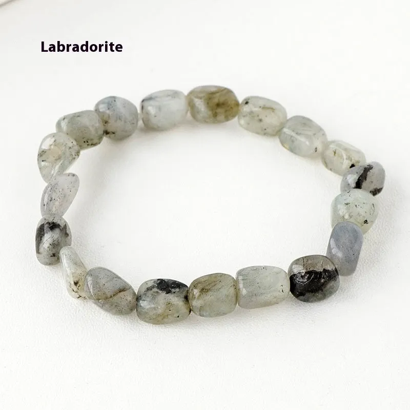 Natural amethyst large particle gravel rolling stone bracelet on a plain background showing smooth rounded beads