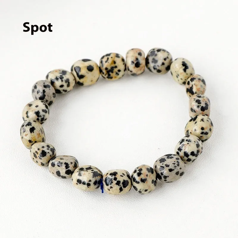 Natural amethyst large particle gravel rolling stone bracelet on a plain background showing smooth rounded beads