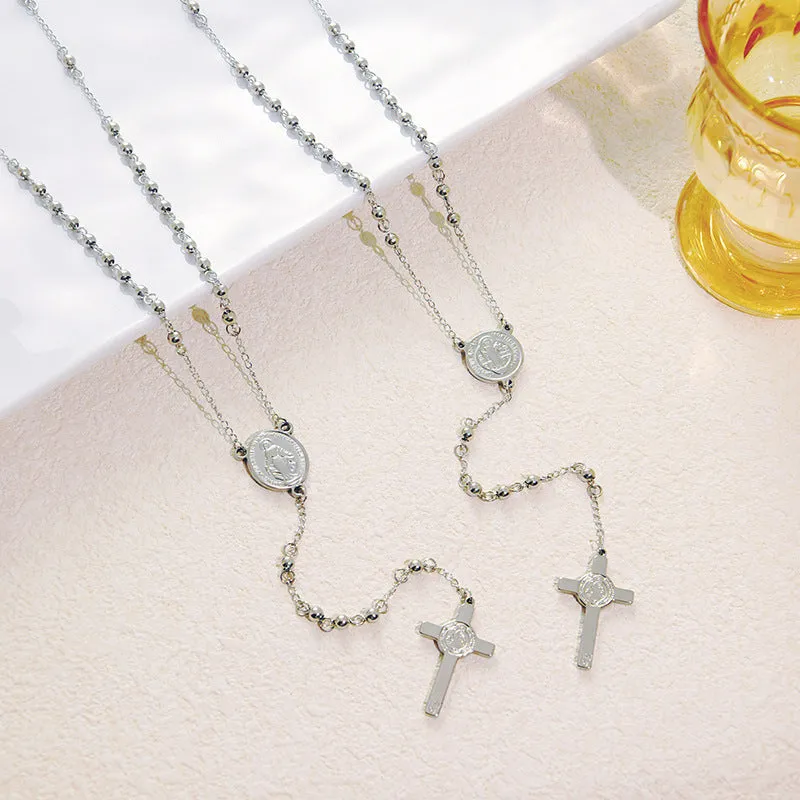 Stainless steel cross pendant necklace in golden colour with a priest pendant design on a simple chain