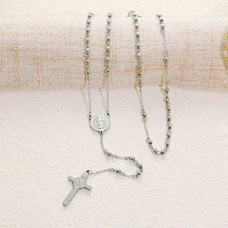Stainless steel cross pendant necklace in golden colour with a priest pendant design on a simple chain