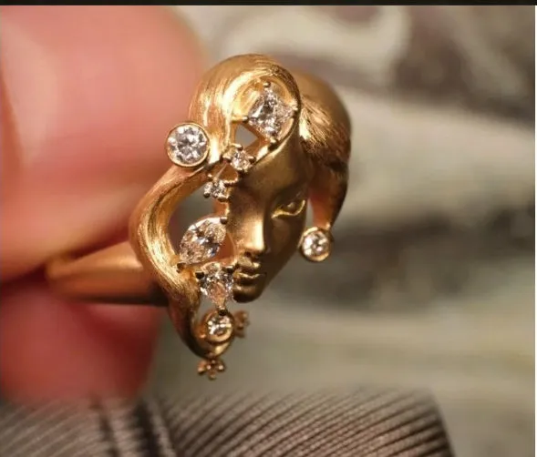Gold antique portrait creative ring with adjustable opening on display