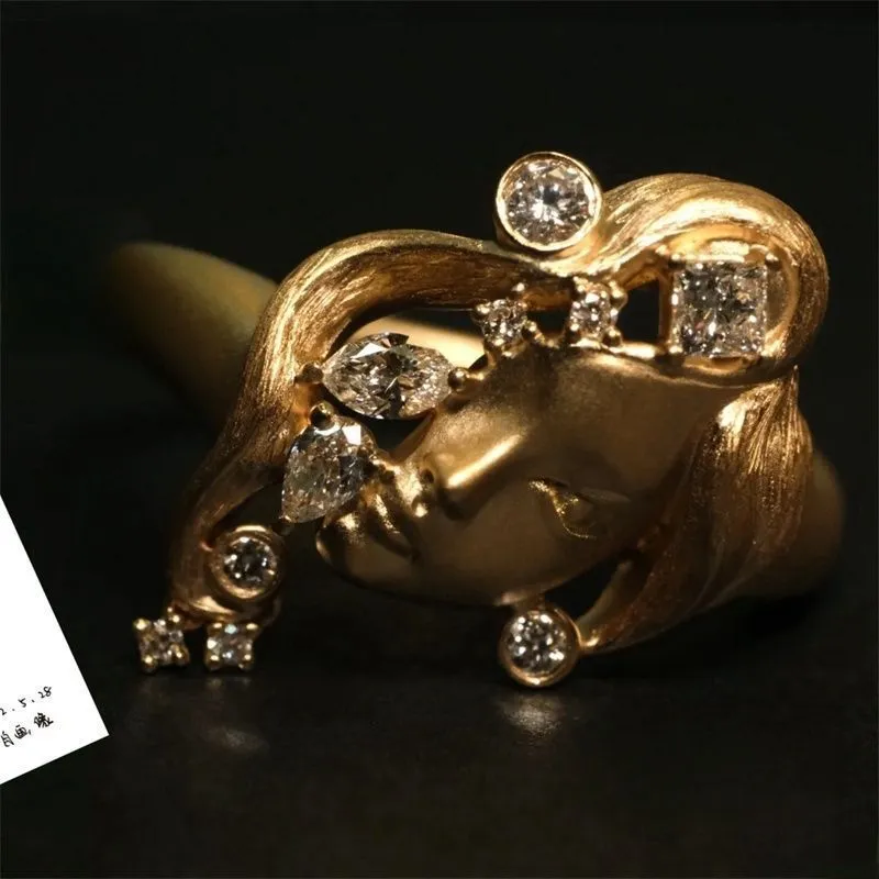 Gold antique portrait creative ring with adjustable opening on display