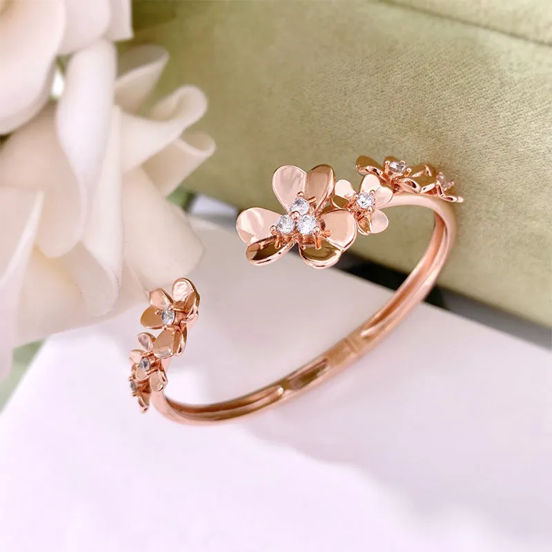 Three-leaf flower micro inlaid zircon bracelet in gold, rose gold, and silver colours on a copper base with electroplated finish.