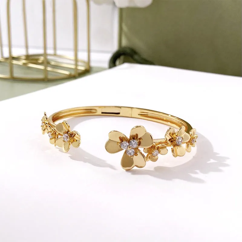 Three-leaf flower micro inlaid zircon bracelet in gold, rose gold, and silver colours on a copper base with electroplated finish.