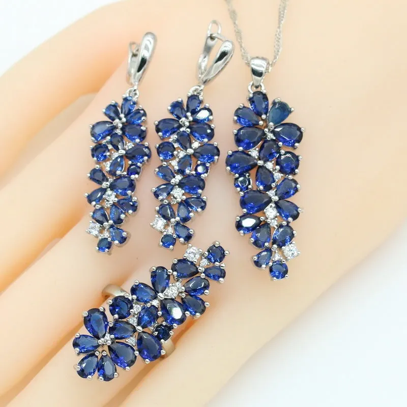 Dark blue copper inlaid zircon retro jewellery set including necklace, earrings, ring, and bracelet on display