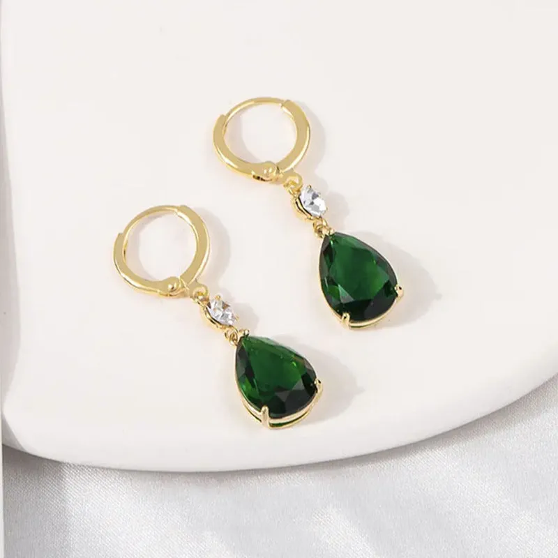Green geometric teardrop alloy earrings on a white background